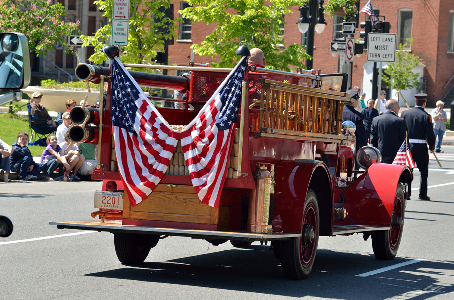 Vintage fire engine with american flags.