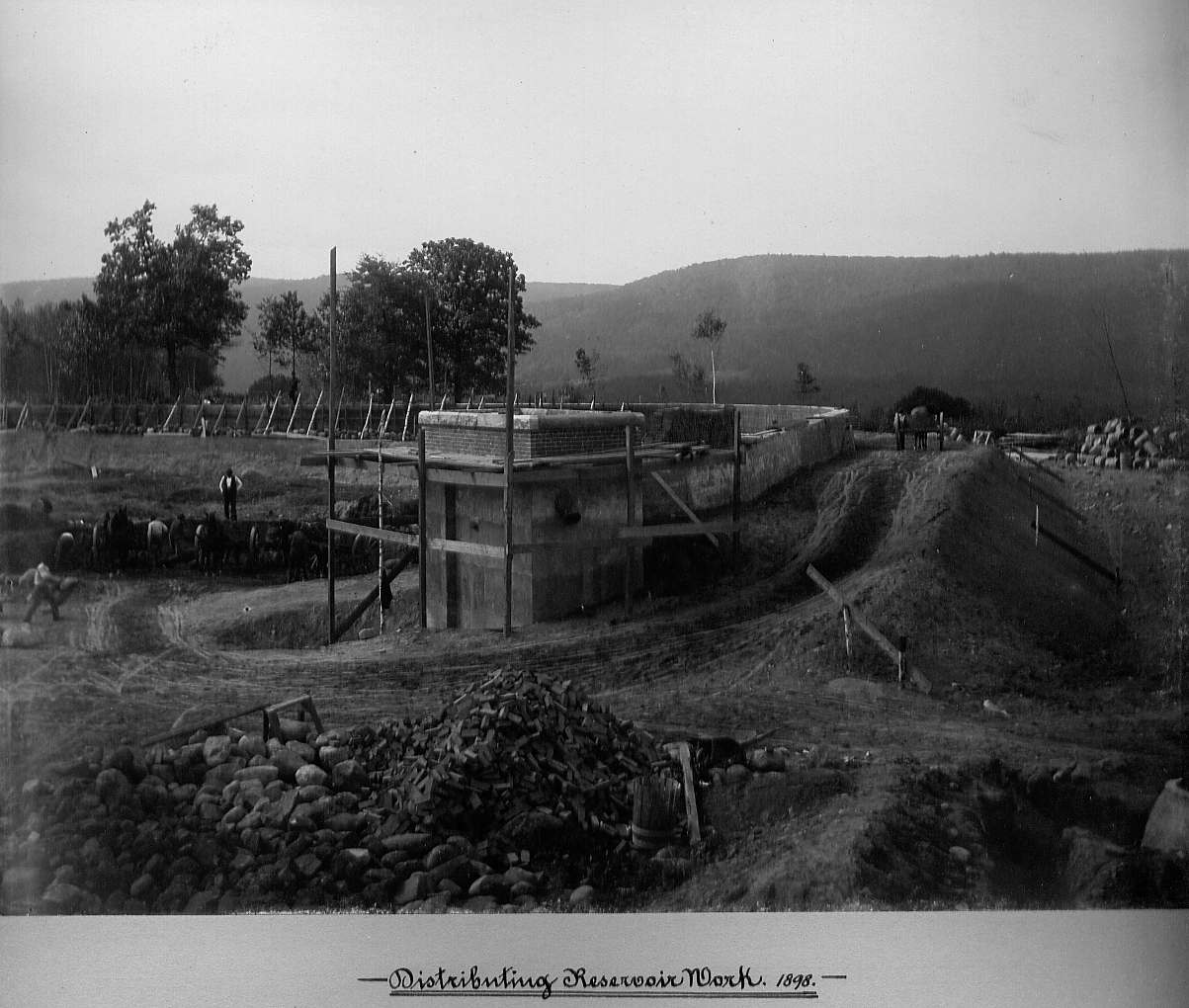 Men excavating the reservoir