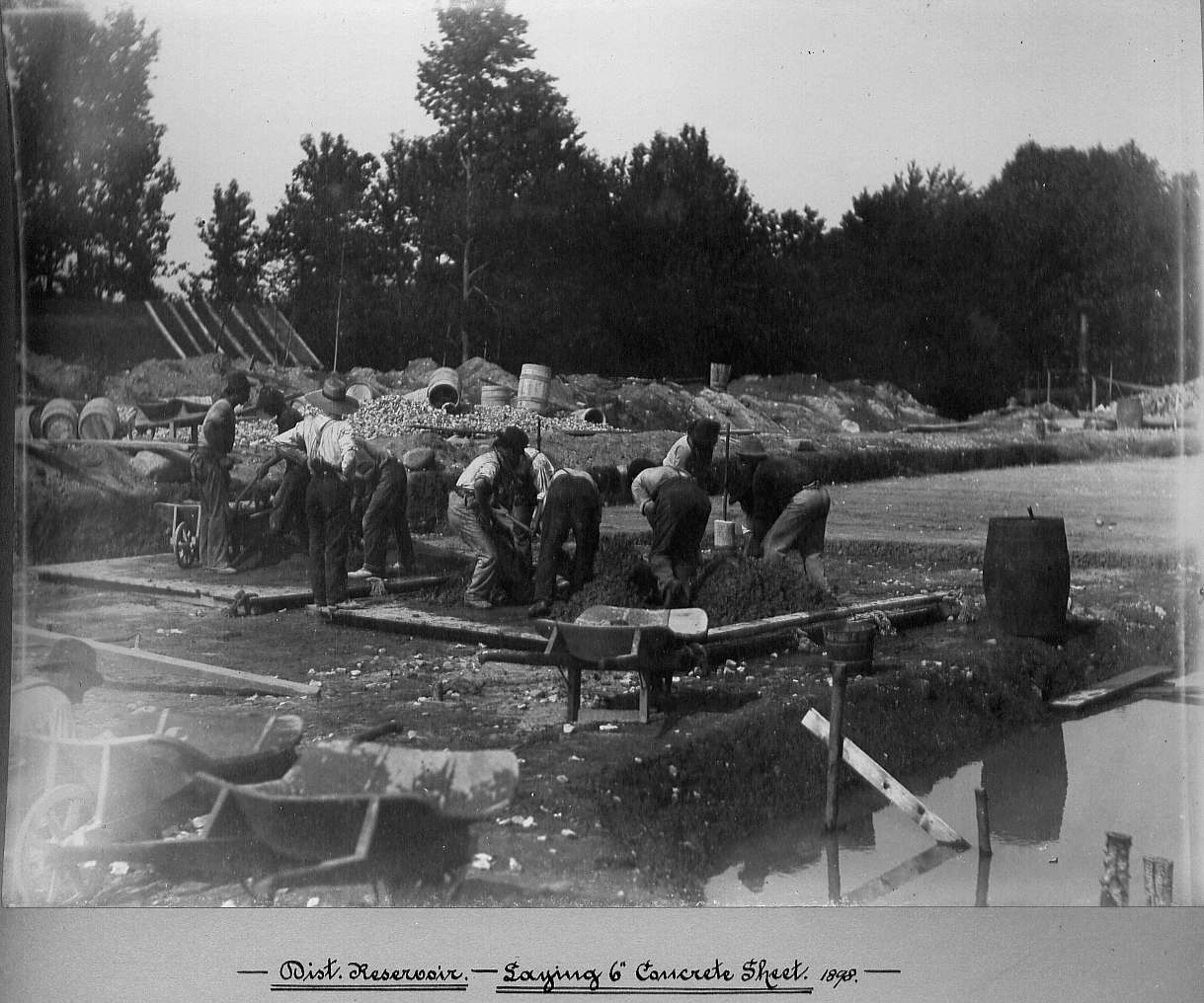 Men mixing the spreading concrete